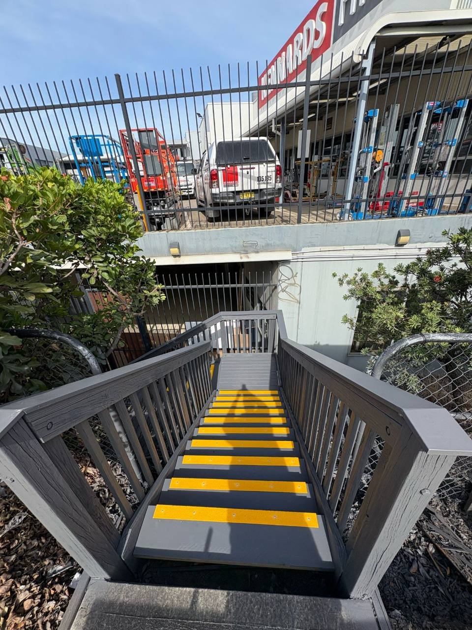 Access stairs with yellow anti-slip nosing to each tread