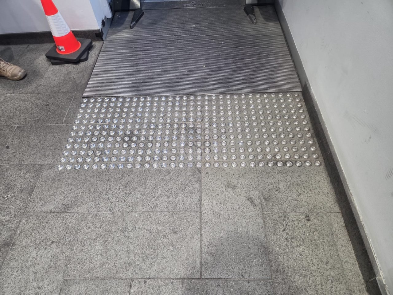 Checker-plate stairs with black anti-slip tread strips