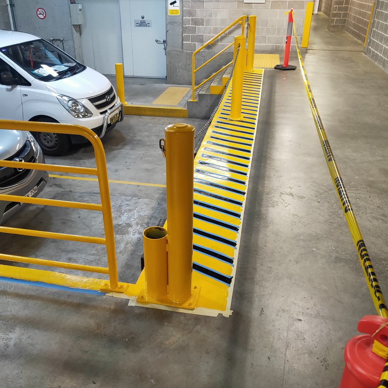 Locked steel security gate with padlocks