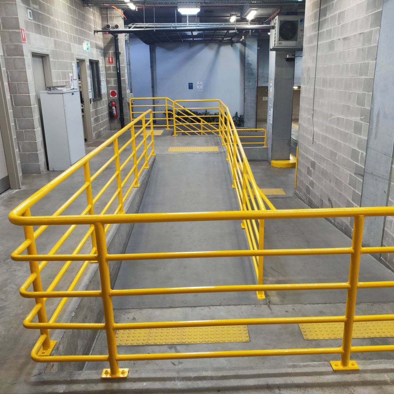 Steel security gate over a service door