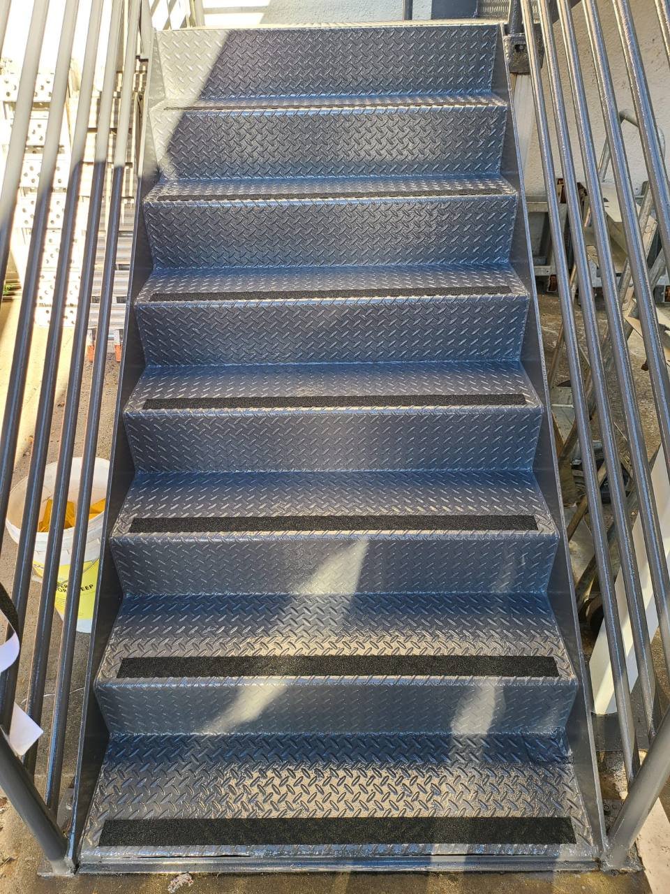 Stainless tactile ground indicators at a building entry